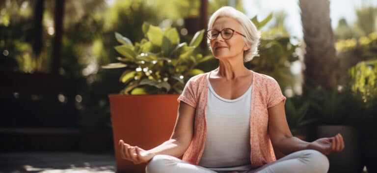 Mature woman using mindful meditation to help manage her tinnitus symptoms